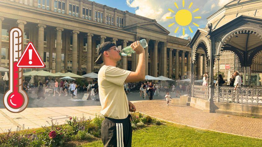 Ein Junge trinkt am Schlossplatz in der Hitze aus einer Waserflasche