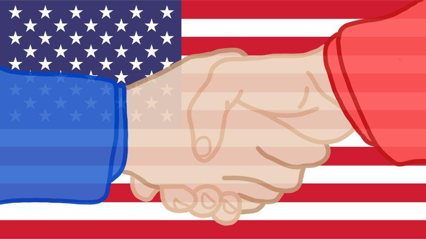 Man sieht einen Handschlag. Im Hintergrund ist die Flagge der USA.